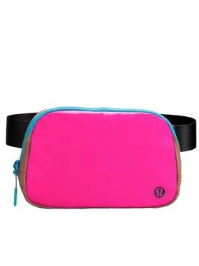 NWOT Lululemon Athletica Crossbody Belt Bag (pink with teal trim & brown sides).